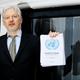Wikileaks founder Julian Assange speaks on the balcony of the Ecuadorean Embassy in London on February 5, 2016 (AP Photo/Kirsty Wigglesworth)